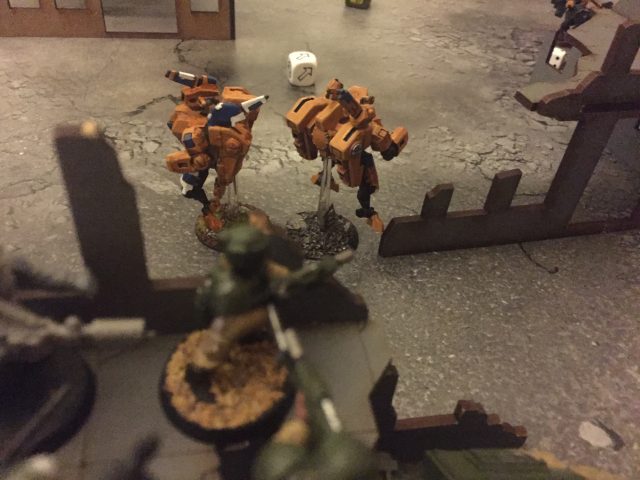 Veteran look down on the Tau, as the Tau look up with Flamers