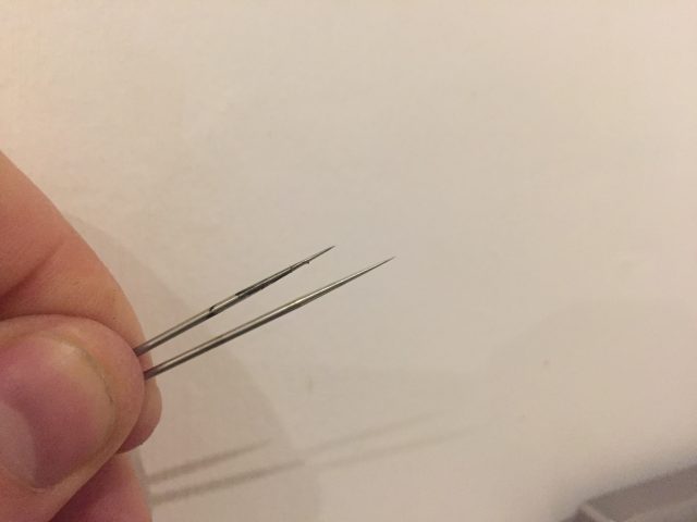 The left/top needle is bent right?