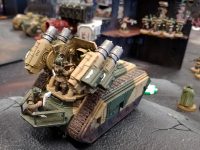 A Cadian Wyvern tucked behind well behind the lines taking aim on the advancing heretics