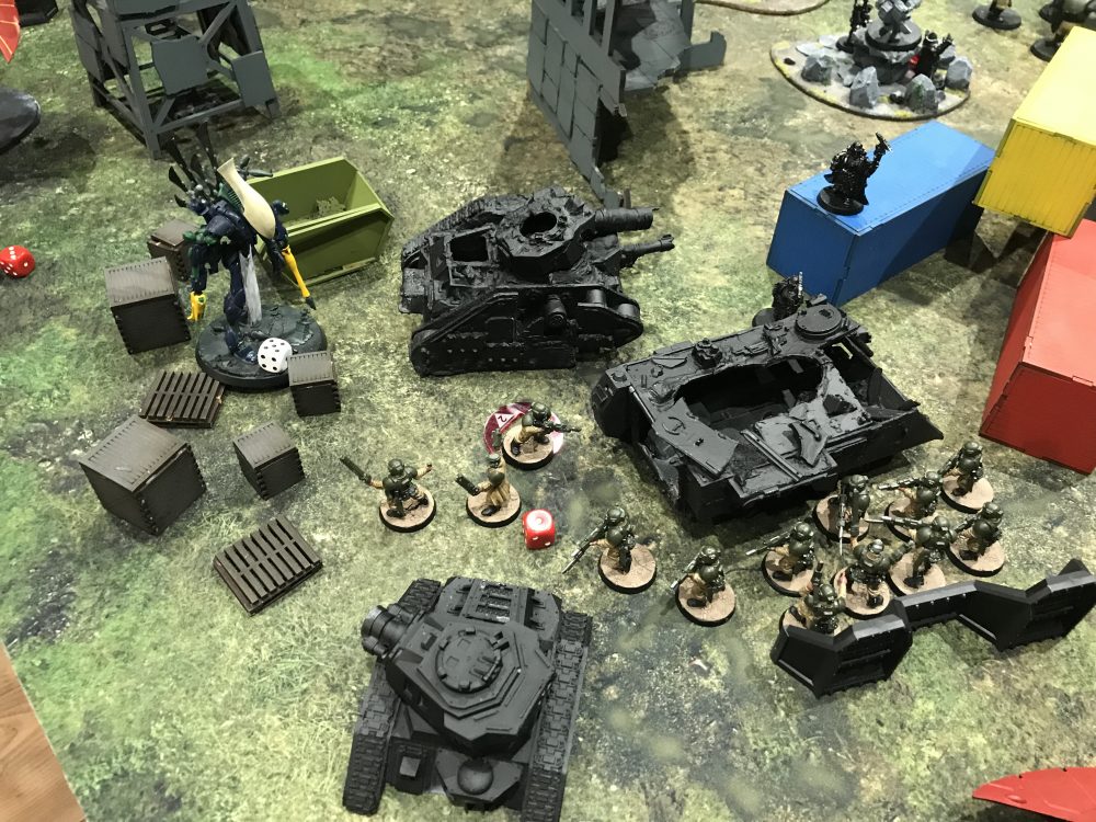 Guardsmen looking on as at the Wraithlord that retreated - Ynnari vs Astra Militarum