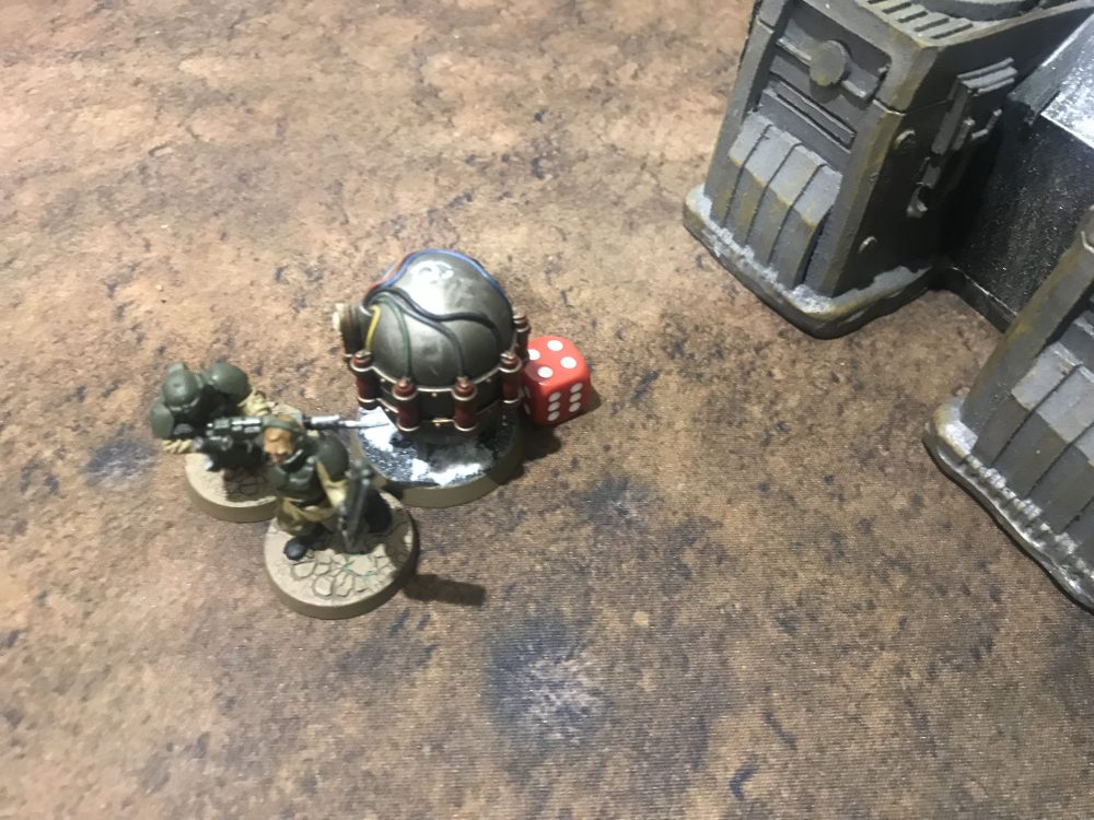 The Guardsmen try and smash the Device