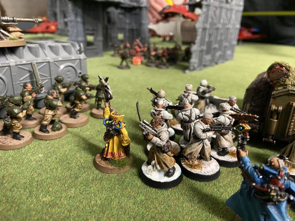 The Valhallans look on as the Catachans take the centre